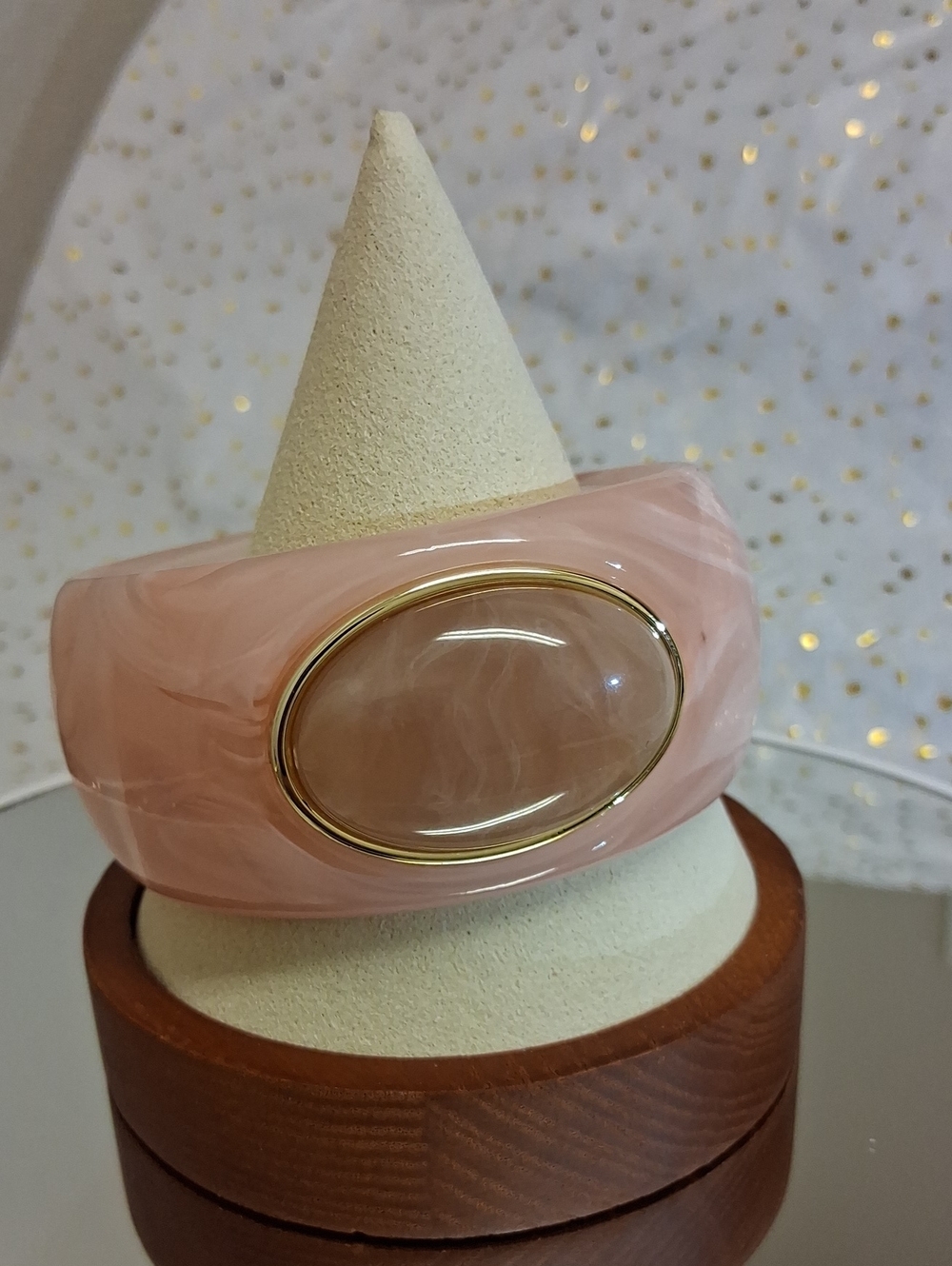 Multi Shaded Bangle With Oval Taupe Center Faux Stone.